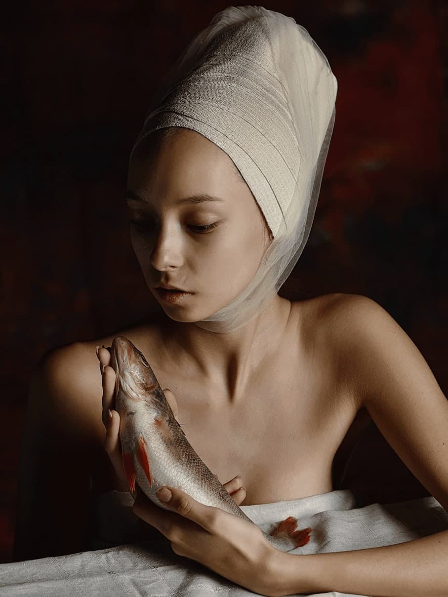 The sacrament. Portrait with a fish.